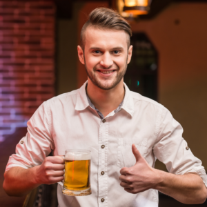 Man Holding beer mug smiling with a thumbs up